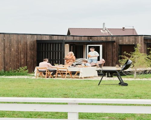 A family gathered around a wooden table having lunch in a Mexican home